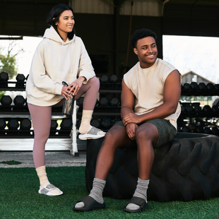 male and female model sitting in gym setting wearing ooahh sport flex labyrinth