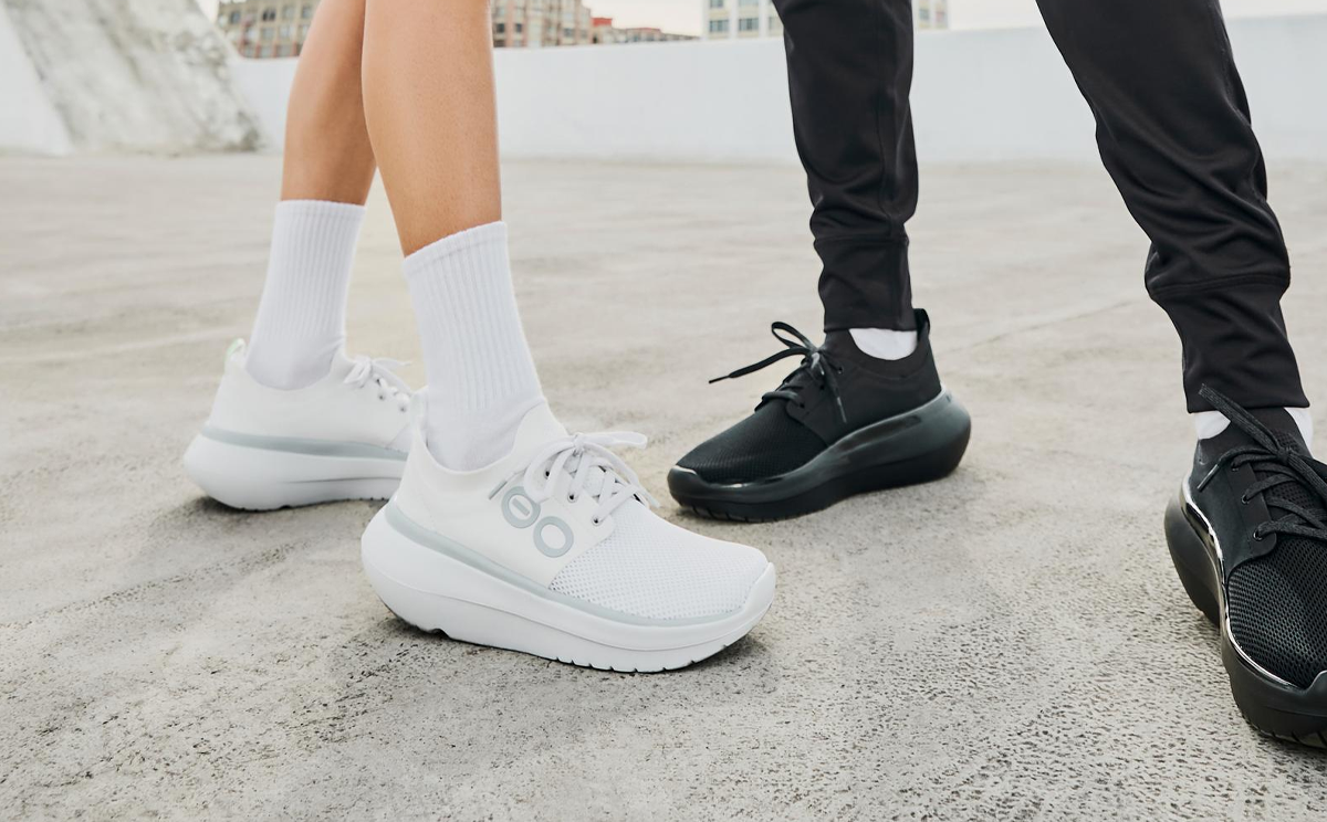 Women's OOmy Stride - White models standing outside wearing oomy stride white and oomy stride black | lifestyle