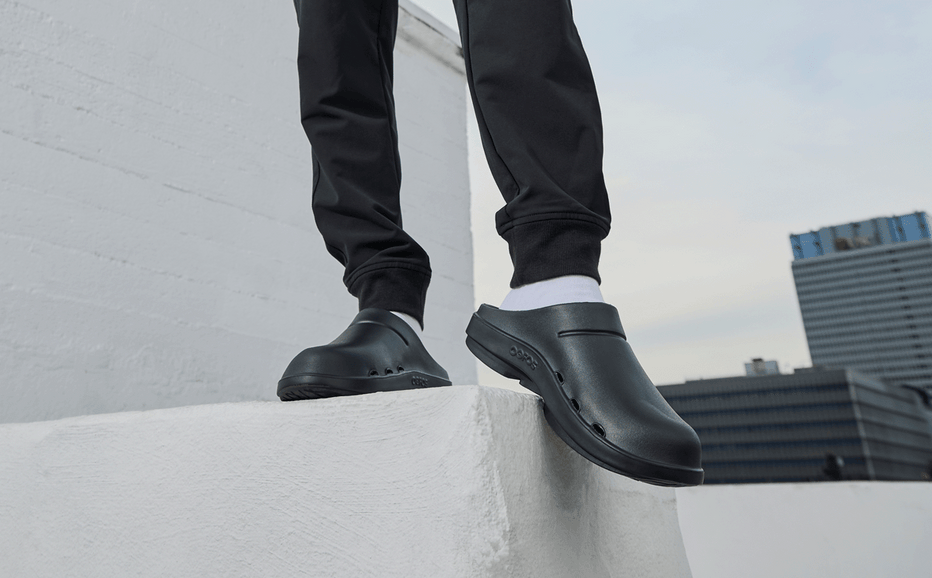 Men's OOcloog Clog - Black model standing on block outside