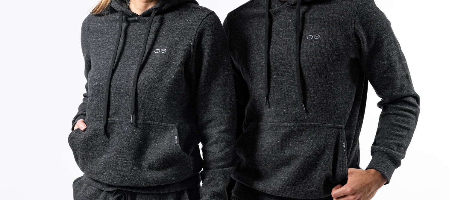 Female and Male OOFOS hoodies on model