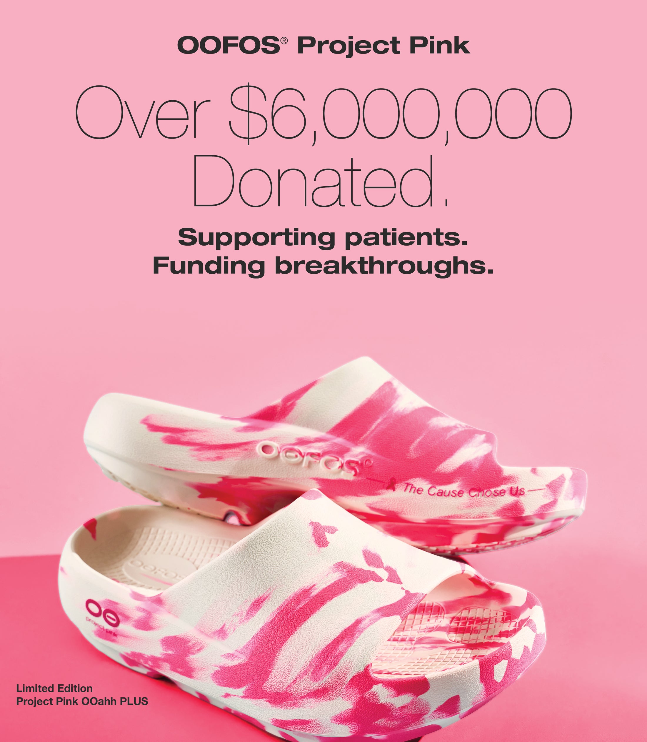 Pink and white OOFOS sandals with text about Project Pink and donation details on a pink background