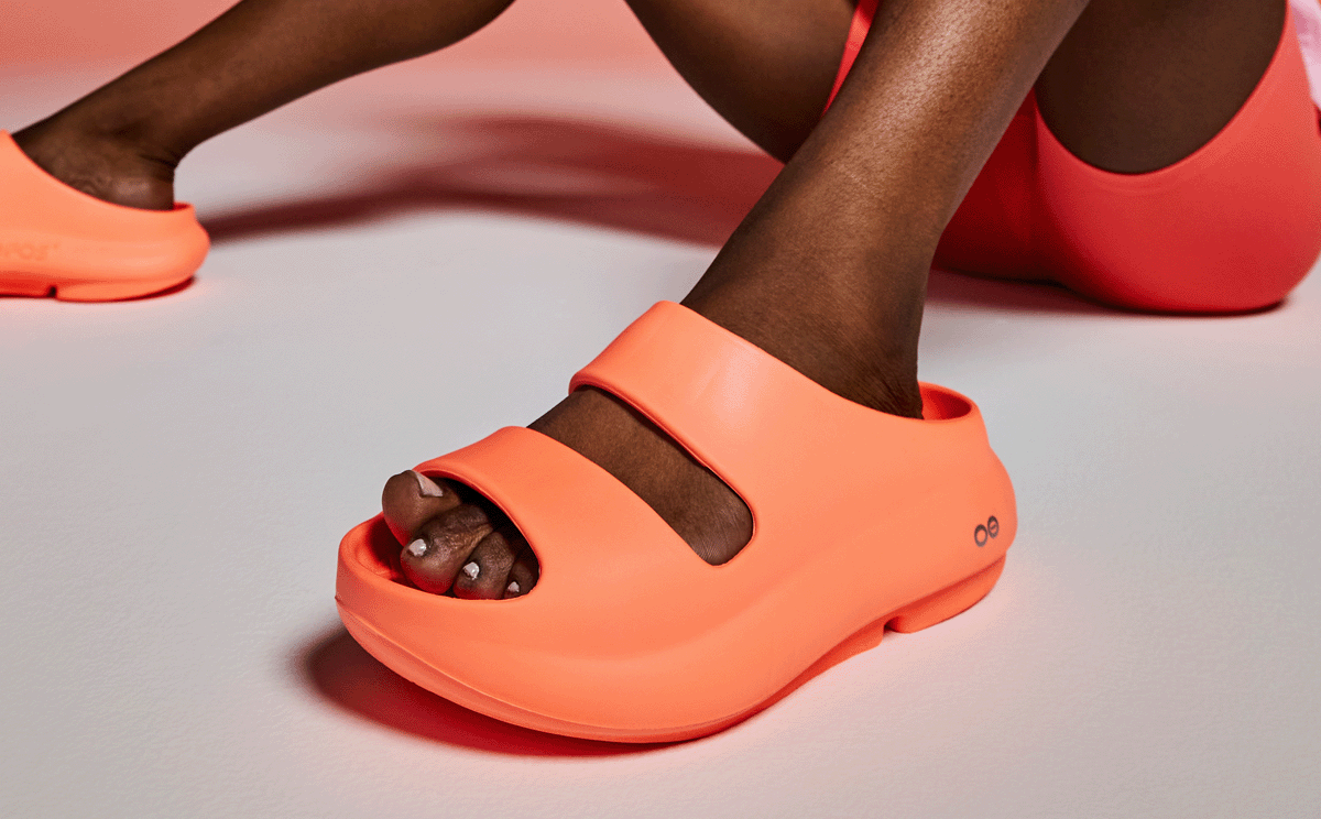 Women's OOyea Slide Sandal - Sunburst model sitting down in studio | lifestyle