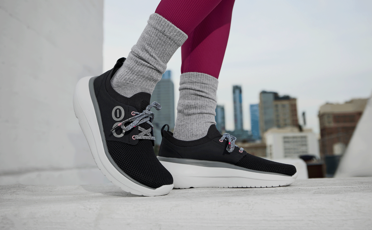 Women's OOmy Stride - White Black model posing outside | lifestyle