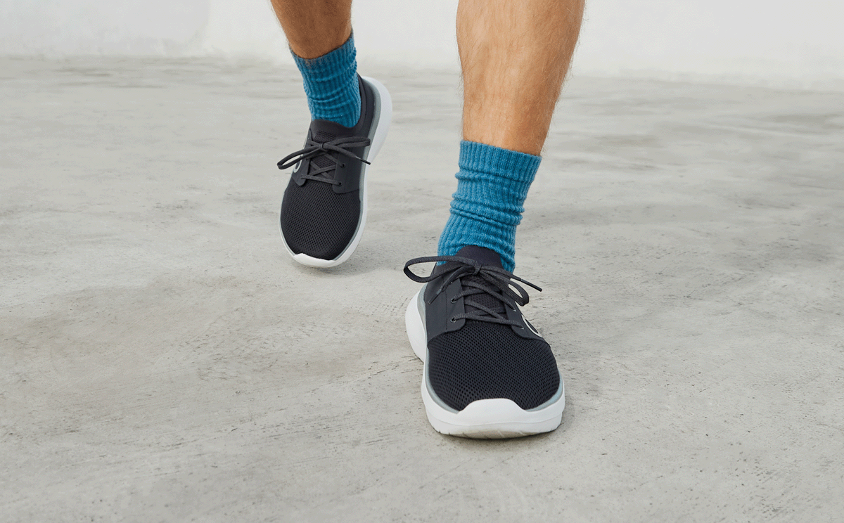 Men's OOmy Stride - White Black front view of model walking outside | lifestyle