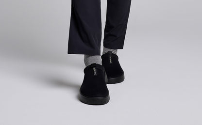 Women's OOcoozie Sport Mule - Black model walking in studio | lifestyle