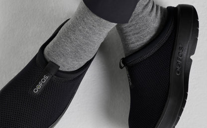 Women's OOcoozie Sport Mule - Black top view close up of shoes on models feet in studio | lifestyle