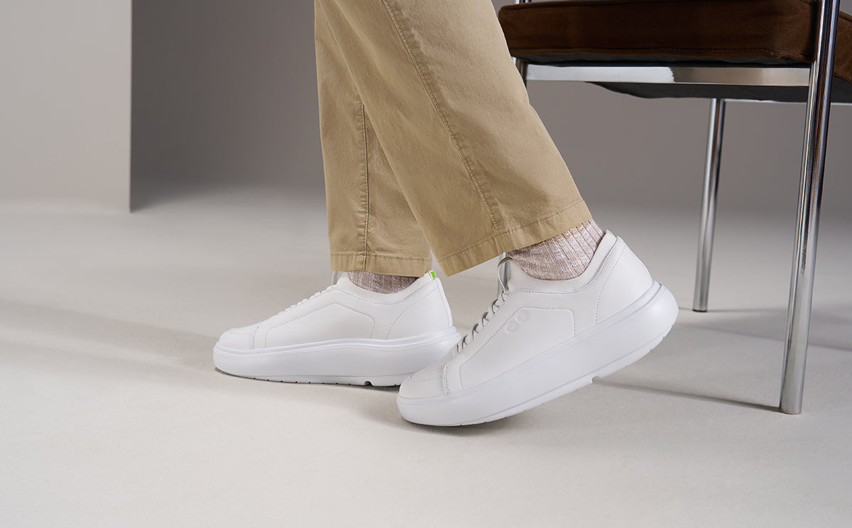 model walking in studio wearing white club plus | lifestyle