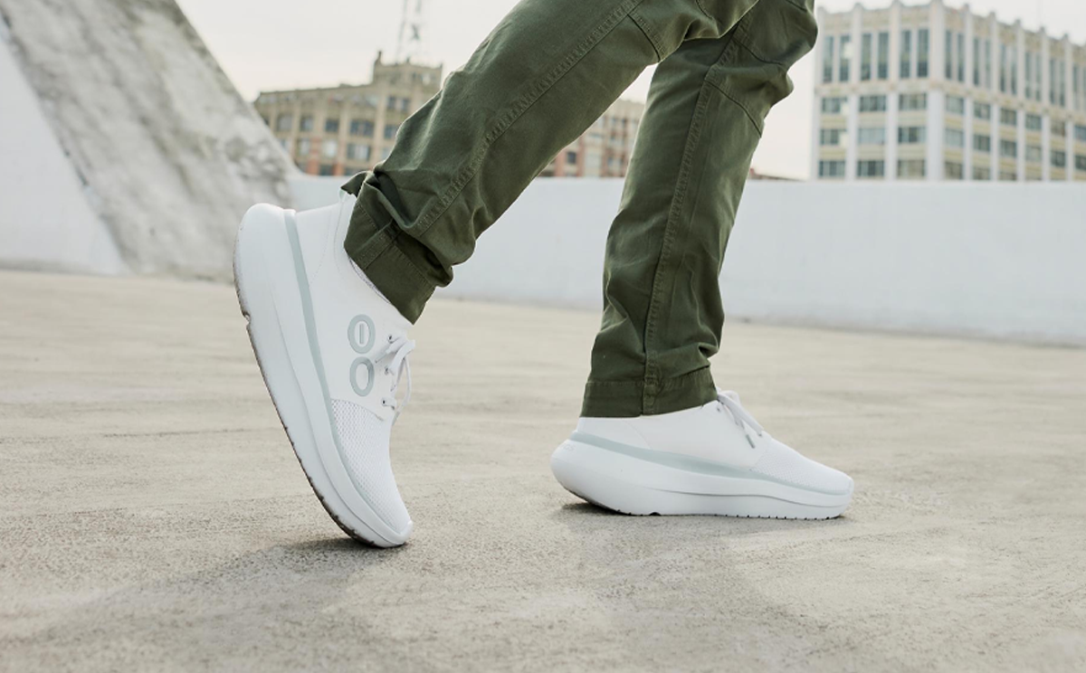 Men's OOmy Stride - White model walking outside | lifestyle