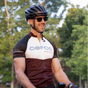 head shot of alex smith on bike outside