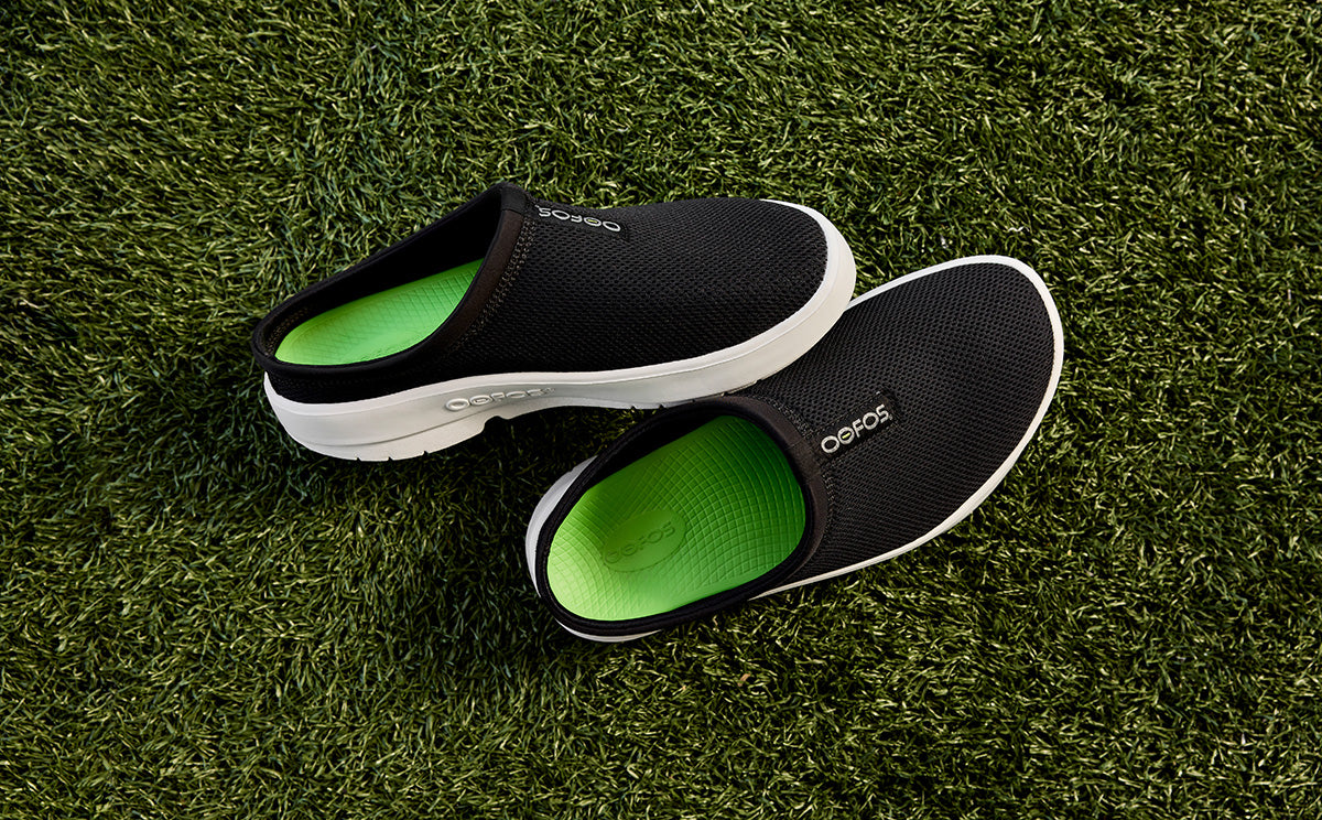 Men's OOcoozie Sport Mule - White Black top view of shoes on grass | lifestyle