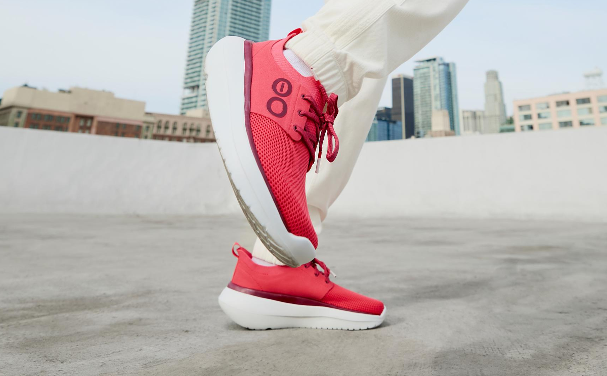 Women's OOmy Stride - Neon Berry model standing outside | lifestyle