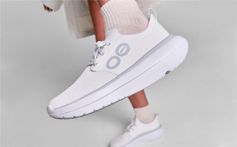 Women's OOmy Stride - White close up of shoe on model in studio | lifestyle