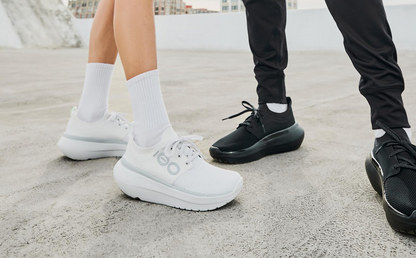 Women's OOmy Stride - White models standing outside wearing oomy stride white and oomy stride black | lifestyle