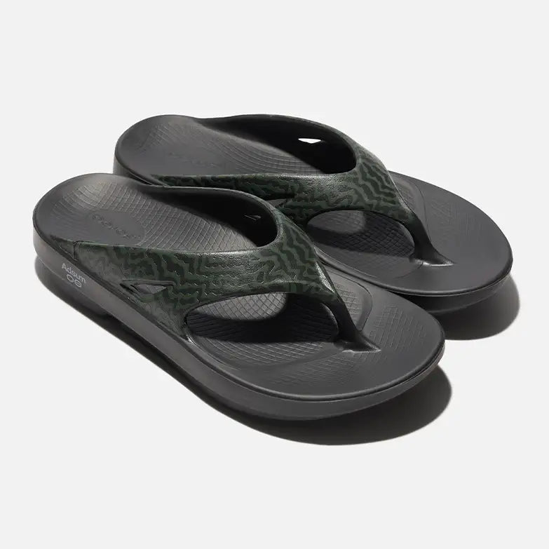 A pair of OOFOS × Adsum OOriginal Limited Sandals on an isolated light-colored background.