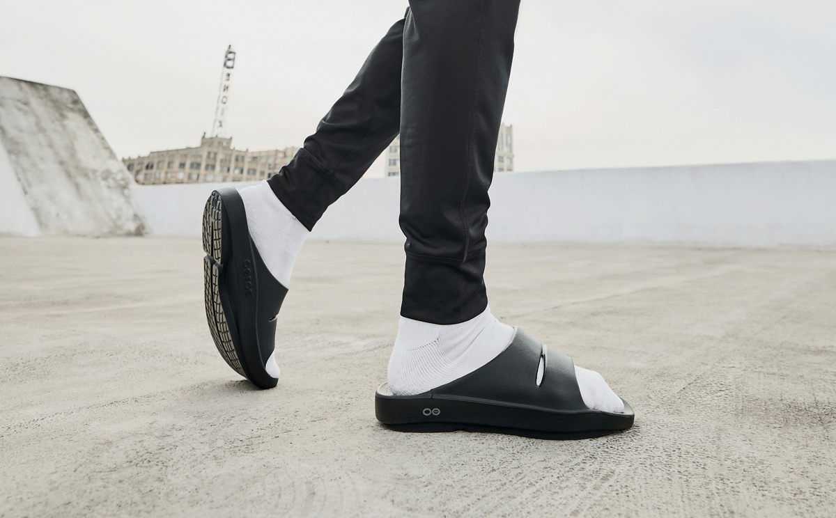 Men's OOahh Slide Sandal - Black model posing outside | lifestyle