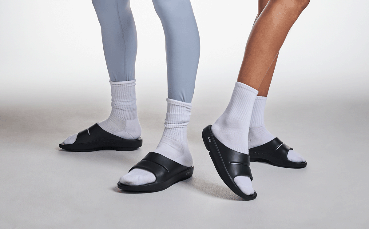 OOahh Slide Sandal - Black male and female model posing in studio | lifestyle