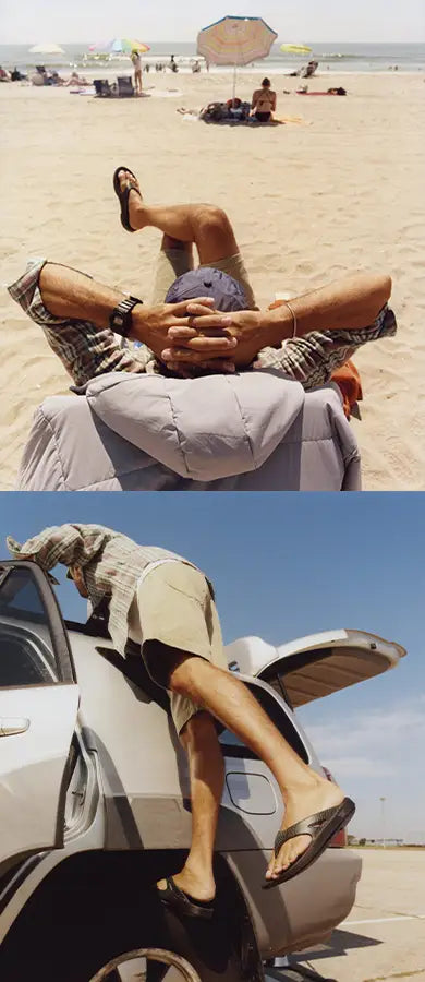 A masculine figure sitting in a beach chair with legs crossed, arms behind he head. On their feet are OOFOS × Adsum OOriginal Limited Sandals. The same figure is seen in another photo securing an item to the roof of a car, with the OOFOS × Adsum OOriginal Limited Sandals on their feet.
