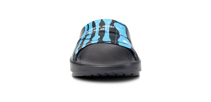 BAUER/OOFOS Women's OOahh Limited Slide Sandal Bauer Skeleton close up of model wearing shoes