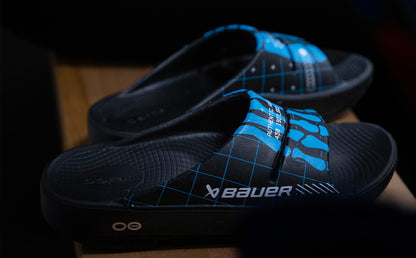 BAUER/OOFOS Women's OOahh Limited Slide Sandal Bauer Skeleton close up of both shoes