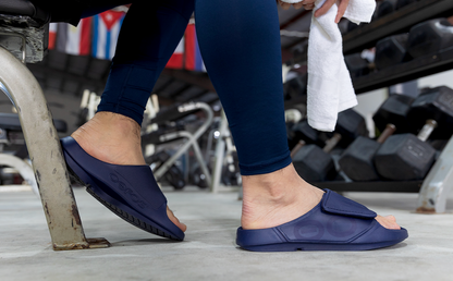 Men's OOahh Sport Flex Sandal - Navy side view of model weaaring shoes | lifestyle