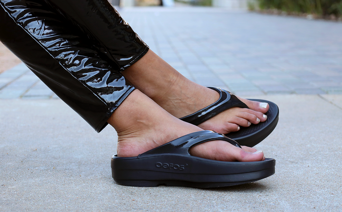 Women's OOmega OOlala Sandal - Black close up of shoes on model | lifestyle